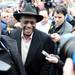 Republican presidential candidate Herman Cain smiles as he makes his way past supporters and media into the Big Sky Diner in Ypsilanti during a stop on Thursday morning. Melanie Maxwell I AnnArbor.com